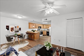 A modern kitchen with a dining table and chairs.
